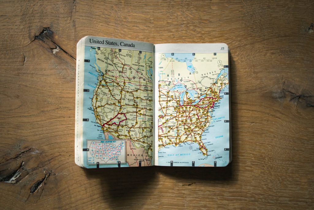 Map of the United States in a Travel Book on a wood plank