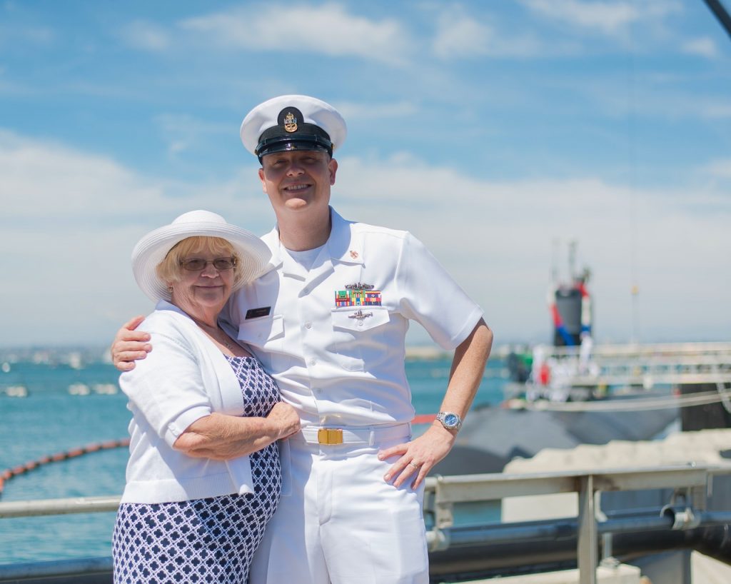 A service member of the USN with their grandmother